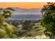 Scenic view showcasing the mountains, trees, and sunset at 23060 Hope Dale Ave, Parker, CO 80138