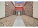 Inviting building entrance with brick accents and stone walkway, leading to the main door at 14720 E Kentucky Dr # 612, Aurora, CO 80012
