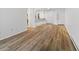 Open-concept living room featuring vinyl wood flooring and natural light at 14720 E Kentucky Dr # 612, Aurora, CO 80012