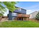 A spacious backyard with a wooden deck offers outdoor living and entertainment space at 5124 S Jebel St, Centennial, CO 80015