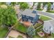 Backyard view of a home featuring a wooden deck, well-maintained lawn, and privacy fence at 5124 S Jebel St, Centennial, CO 80015