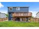 A spacious backyard with a wooden deck offers outdoor living and entertainment space at 5124 S Jebel St, Centennial, CO 80015