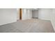 Spacious basement with neutral walls and plush carpet provides ample room for storage at 5124 S Jebel St, Centennial, CO 80015