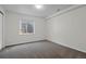 Basement with neutral walls and plush carpet offers natural light for your dream space at 5124 S Jebel St, Centennial, CO 80015