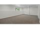 Spacious basement with neutral walls and plush carpet is a blank canvas for your dream space at 5124 S Jebel St, Centennial, CO 80015