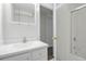 A bright bathroom features a neutral sink, vanity, and a shower/tub combo at 5124 S Jebel St, Centennial, CO 80015