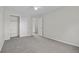 Bright bedroom boasts neutral walls, plush carpet, and ample storage with closet and easy access to other areas at 5124 S Jebel St, Centennial, CO 80015