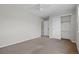 A bright bedroom features neutral walls, plush carpet, and a large closet for ample storage at 5124 S Jebel St, Centennial, CO 80015