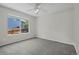 A spacious bedroom featuring a bright window and neutral carpet at 5124 S Jebel St, Centennial, CO 80015