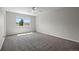 Spacious and bright bedroom with ceiling fan, large window, and neutral carpeting at 5124 S Jebel St, Centennial, CO 80015