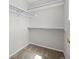 Walk-in closet offers ample storage with adjustable shelving and a neutral carpet at 5124 S Jebel St, Centennial, CO 80015