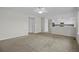 View of the open living room shows the adjacent kitchen and entry to other rooms at 5124 S Jebel St, Centennial, CO 80015