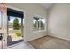 Neutral living room showcasing a view to the home's exterior at 5124 S Jebel St, Centennial, CO 80015