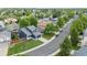 Two-story home with lush front lawn and ample street parking, situated in a verdant neighborhood at 5124 S Jebel St, Centennial, CO 80015