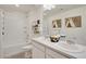 Bathroom with double vanity, bathtub, and shower at 17919 Dandy Brush Dr, Parker, CO 80134