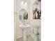 Small bathroom with pedestal sink and modern vanity at 17919 Dandy Brush Dr, Parker, CO 80134