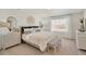 Bright bedroom with a large bed and neutral decor at 17919 Dandy Brush Dr, Parker, CO 80134