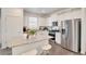 Modern kitchen with white cabinets, granite countertops, and stainless steel appliances at 17919 Dandy Brush Dr, Parker, CO 80134