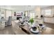 Open concept kitchen and dining area, featuring modern appliances and an island at 17919 Dandy Brush Dr, Parker, CO 80134