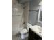 Modern bathroom featuring a tiled shower and brushed nickel fixtures at 665 S Clinton St # 14A, Denver, CO 80247