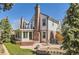 Charming home featuring a beautiful backyard, large patio, and a well-manicured lawn perfect for outdoor gatherings at 7559 S Ivanhoe Cir, Centennial, CO 80112