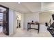 Clean basement with storage closet, desk, and neutral walls and carpet at 7559 S Ivanhoe Cir, Centennial, CO 80112