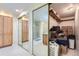 Bathroom with a shower, mirrored doors, and shelving for storage at 7559 S Ivanhoe Cir, Centennial, CO 80112
