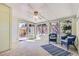 Bright sunroom with large windows, providing natural light, and a serene space to enjoy the outdoors indoors at 7559 S Ivanhoe Cir, Centennial, CO 80112