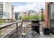 Outdoor balcony featuring a grill, dining area, and city views in a vibrant, urban neighborhood at 1440 Little Raven St # 202, Denver, CO 80202