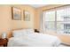 Calm bedroom with a large window and comfortable furnishings at 1440 Little Raven St # 202, Denver, CO 80202