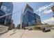 Modern cityscape featuring pedestrian bridge with steel cable supports and striking building with unique architecture at 1440 Little Raven St # 202, Denver, CO 80202