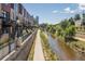 Scenic shot of townhomes next to the calm river at 1440 Little Raven St # 202, Denver, CO 80202