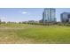 Expansive green space with modern buildings in the background at 1440 Little Raven St # 202, Denver, CO 80202