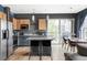 Inviting open kitchen and dining area with stainless steel appliances and plenty of natural light at 1440 Little Raven St # 202, Denver, CO 80202