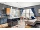 Bright living space featuring modern kitchen, dining area, and comfortable seating, all with city views at 1440 Little Raven St # 202, Denver, CO 80202