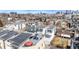 An urban residential area with modern townhomes, featuring rooftop decks and solar panels at 3142 W 20, Denver, CO 80211