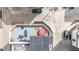 Aerial view of a rooftop deck with blue seating arrangements and a hot tub, in an urban setting at 3142 W 20, Denver, CO 80211