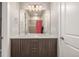 Bathroom featuring a double sink vanity with modern fixtures and a shower with a glass door at 3142 W 20, Denver, CO 80211