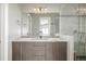 Bathroom featuring double vanity with decorative backsplash and glass enclosed shower at 3142 W 20, Denver, CO 80211