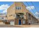Modern townhouse exterior with a private balcony, garage access, and well-kept landscaping at 3142 W 20, Denver, CO 80211