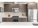 Well-equipped kitchen with stainless steel appliances and decorative backsplash at 3142 W 20, Denver, CO 80211