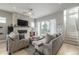 Cozy living room featuring a stone fireplace, plush seating, and sliding glass doors at 3142 W 20, Denver, CO 80211