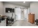 Study features a desk, chair, storage drawers and barn door creating a versatile, functional area at 3142 W 20, Denver, CO 80211