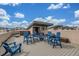 Rooftop deck with blue Adirondack chairs and tables, ideal for entertaining and enjoying the sky view at 3142 W 20, Denver, CO 80211