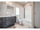 Clean bathroom with bathtub, vanity, and modern fixtures at 2030 W 66Th Ave, Denver, CO 80221