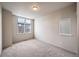 Generous-sized bedroom with large windows and carpet flooring at 2030 W 66Th Ave, Denver, CO 80221