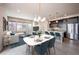 Modern dining area with table and chairs, open to kitchen at 2030 W 66Th Ave, Denver, CO 80221