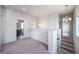 Open hallway with access to bedrooms and bathroom at 2030 W 66Th Ave, Denver, CO 80221