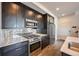 Modern kitchen with stainless steel appliances at 2030 W 66Th Ave, Denver, CO 80221