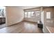 Living room with hardwood floors and sliding glass doors at 2030 W 66Th Ave, Denver, CO 80221